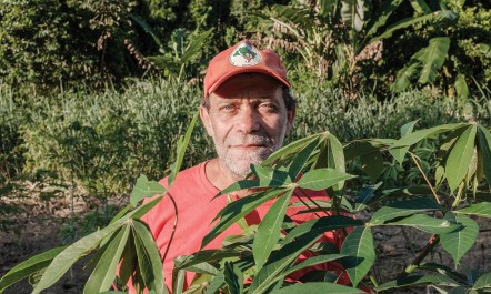 Pedro dos Santos photographed in a farm landscape.