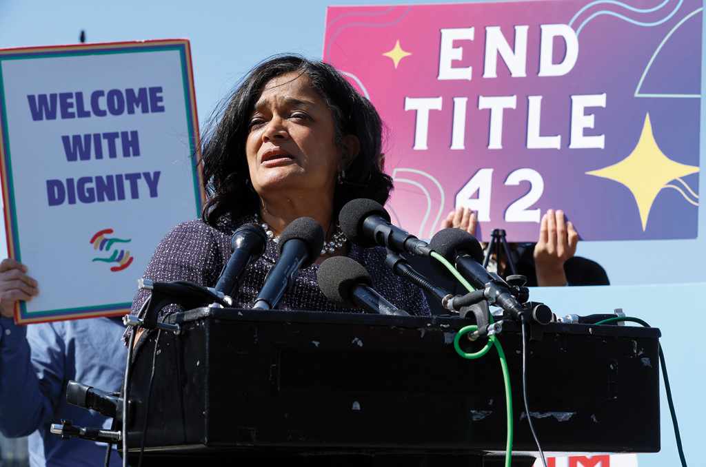 Rep. Pramila Jayapal in April 2022 at a podium to rally for the end to Title 42, a Trump-era measure that prevented asylum-seekers from entering the U.S. under the guise of mitigating the spread of COVID-19. 