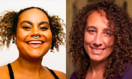 A head photo of two women with curly hair smiling and staring directly into camera.