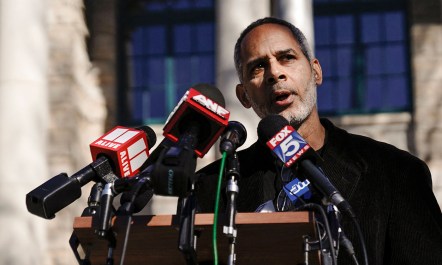 Kamau Franklin speaking at a press conference