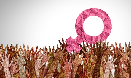 Crowd of hands holing up female symbol.