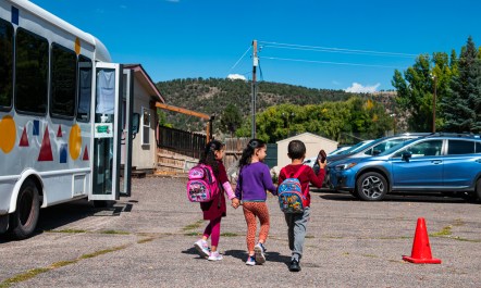 Preschool students walking in a parking lot